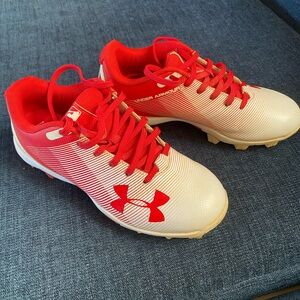 Under Armour youth red and white cleats